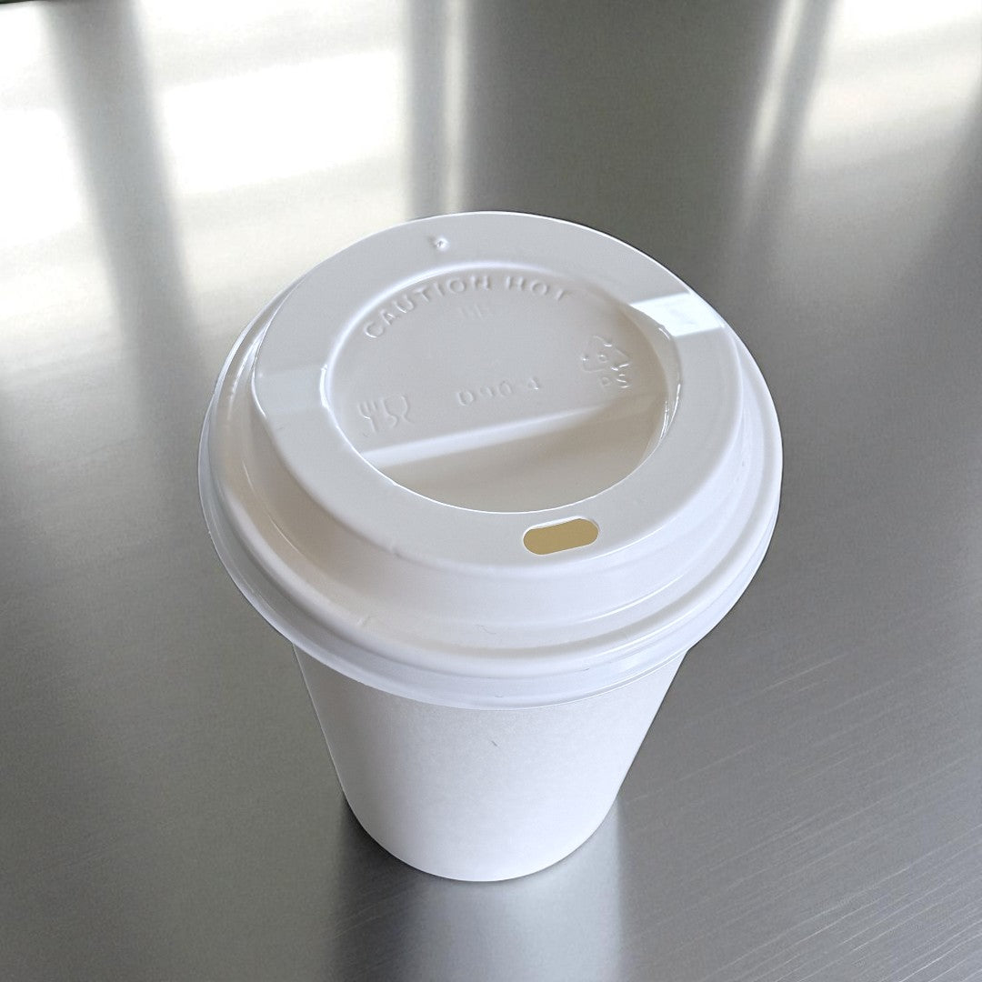 White Single Wall 12oz Paper Cup With White Sip Lids Overhead - Propus Packaging