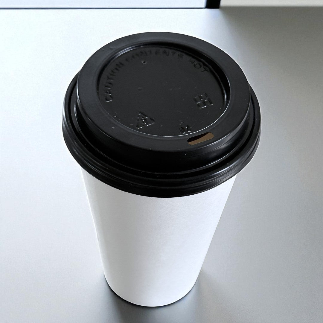 White Single Wall 16oz Paper Cup With Black Sip Lids Overhead - Propus Packaging