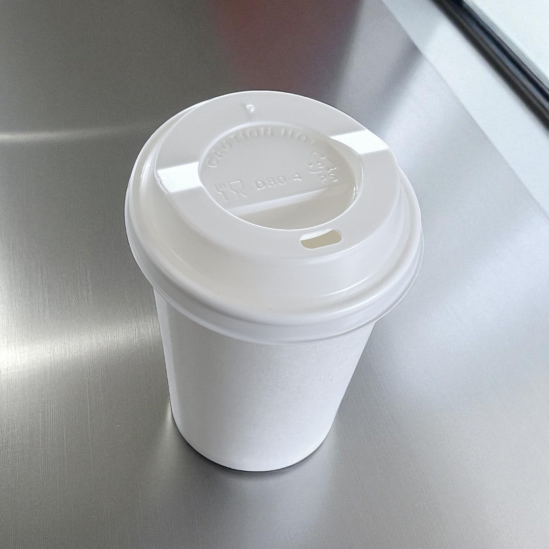 White Single Wall 8oz Paper Cup With White Sip Lids Overhead - Propus Packaging
